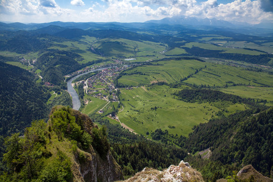 View from the top of the mountain to the Sromowce village by the river. Bialy Dunajec in Pieniny, view from the top of the Three Crowns. The highest peak of the Pieniny, Trzy Korony.