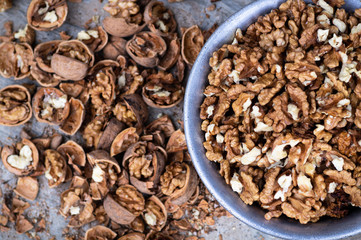 Walnuts kernels with color background, Whole walnut in a metal plate. Walnuts. Walnuts an market. Background of walnuts. Healthy. Fresh