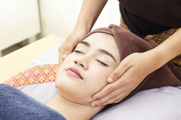 Beautiful girl in the bed for facial massage. Health and beauty. Spa concept.