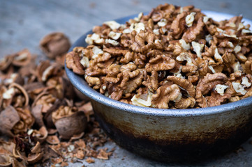 Walnuts kernels with color background, Whole walnut in a metal plate. Walnuts. Walnuts an market. Background of walnuts. Healthy. Fresh