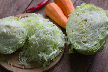 white cabbage cut into strips and carrots for cooking