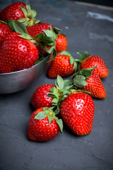 Ripe strawberries on the rustic background. Selective focus.