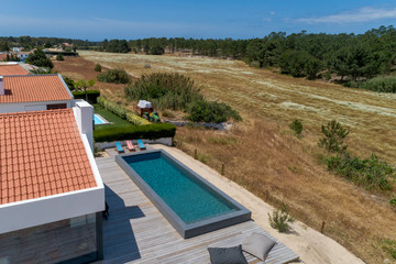Modern house with garden swimming pool and wooden deck