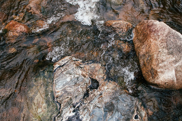 Tropical river flowing rapid water and rocks landscape
