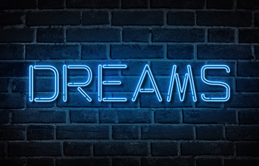 Word Dreams written with neon letters at brick wall background - Powered by Adobe