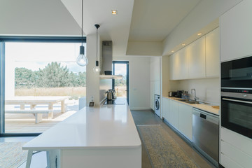 Modern house with garden swimming pool and wooden deck