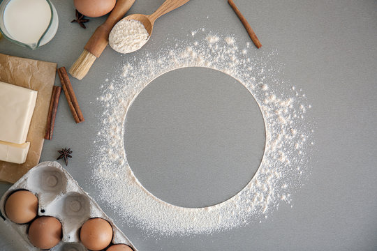 Flat lay composition with kitchen utensils and products on grey background. Bakery workshop