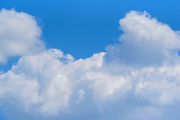 Naklejka na ściany i meble white clouds against the blue sky