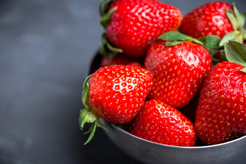Ripe strawberries on the rustic background. Selective focus.