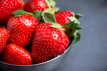 Ripe strawberries on the rustic background. Selective focus.