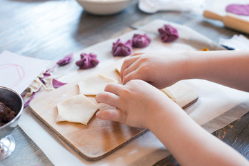 Cooking class, culinary. Food and people concept, molding of pelmeni or meat colorful dumplings,...