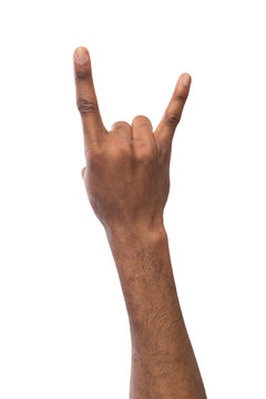 Male black hand making rock'n'roll gesture isolated on white