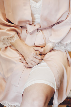 Close up of bride hands during make up