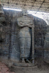 Standing Buddha statue at Gal Vihara rock temple in the ancient city Polonnaruwa, Sri Lanka