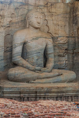 Fototapeta na wymiar Sitting Buddha statue at Gal Vihara rock temple in the ancient city Polonnaruwa, Sri Lanka