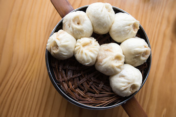 Top view of Chinese food, Xiaolongbao. Steamed Xiaolongbao in The Bamboo Basket.