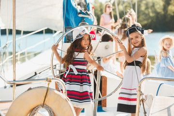 The children on board of sea yacht