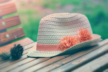 Classic straw hat on the bench