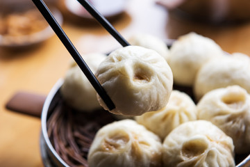 Steamed Xiaolongbao with chopsticks 