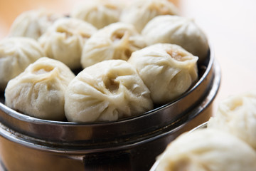Asian Cuisine. Steamed dumplings in a bamboo steamer. 