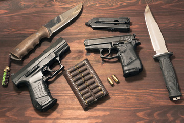 two 9 mm pistols and knives