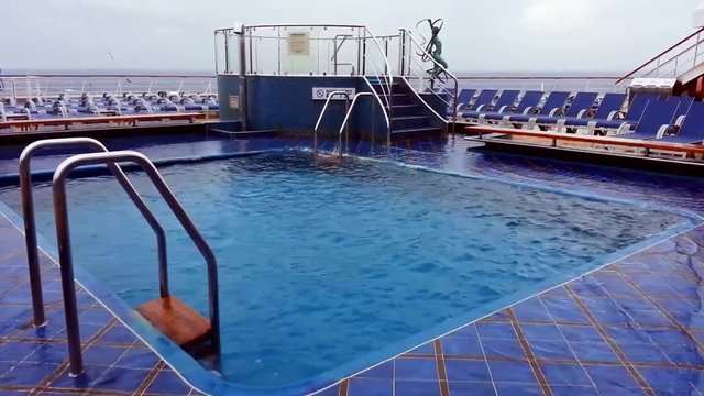 Ship's pool in rough seas. Camera handheld.