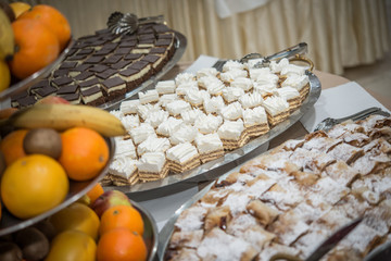 Delicious fruits and cakes serviced in restaurant