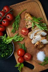 Chicken with tomatoes, parsley and dill.