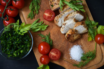 Chicken with tomatoes, parsley and dill.