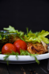 Chicken with tomatoes, parsley and dill. Text