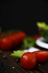 Tomatoes on the background of parsley with dill