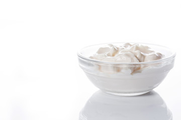 Sour cream in crystal bowl isolated on white background. Copyspace

