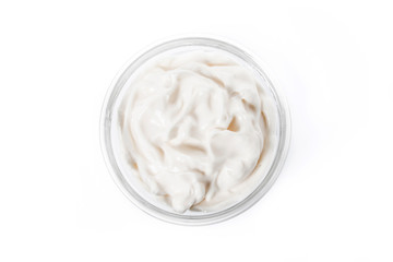 Sour cream in crystal bowl isolated on white background. Top view


