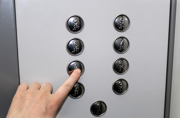 the Elevator button presses the human finger