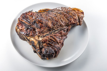 White round plate with Whole grilled T-bone steak