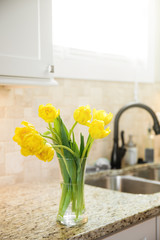 Yellow Tulips on counter in Kitchen