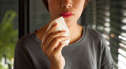 Red lips woman wiping her mouth ,red lips,girl take clean on her lips with white tissue, asian girl using tissue wipe her mouth,girl use napkin,white tissue
