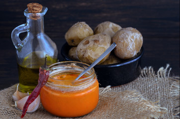 Local Canary Islands dish, Papas Arrugadas (wrinkly potatoes) with Mojo picon (red sauce).