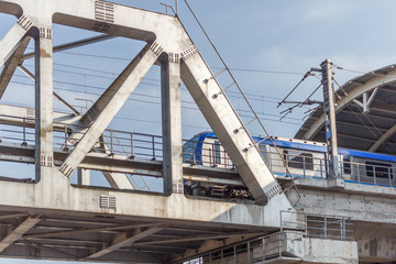 Fototapeta na wymiar Unidentified metro train iron bridge with zigzag lines built using modern day technology in India