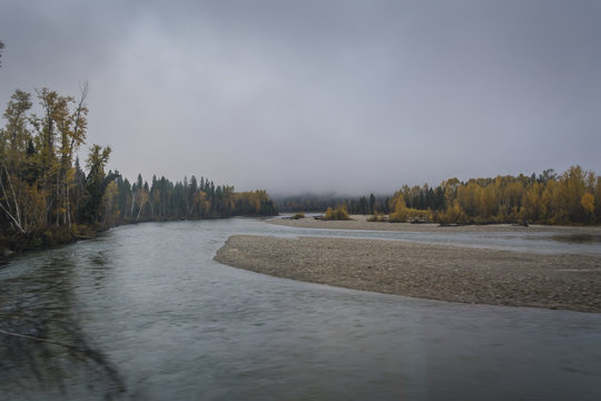 Cloudy day by autumn river