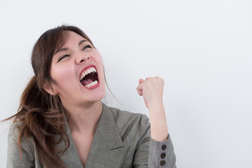 angry woman shouting, screaming with upset mood; portrait of angry upset asian woman shouting or screaming to blank space; harsh and loud noise shouting communication concept; asian adult woman model