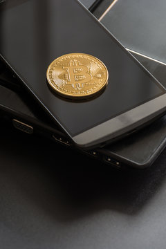 cryptocurrency called bitcoin with laptop and a smartphone.