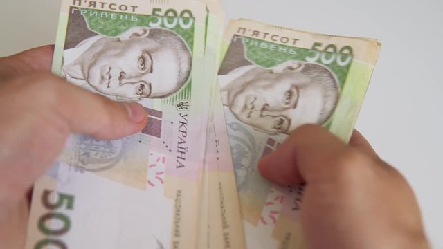  Cash of Ukrainian money - 500 grivna bills close-up, IMF currency tranche for Ukraine 2018-2019.