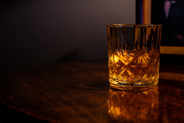 Whiskey on the rocks in a crystal tumbler
