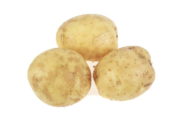 pile of young potatoes on a white background