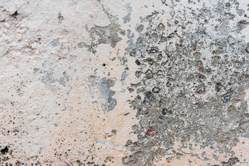 Wall fragment with scratches and cracks