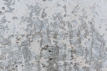 Wall fragment with scratches and cracks