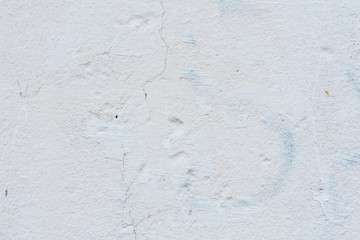 Wall fragment with scratches and cracks