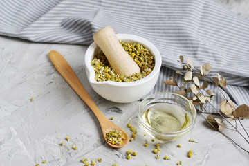 Dried chamomile flowers, natural ingredients for homemade body, face salt scrub, mask, SPA concept