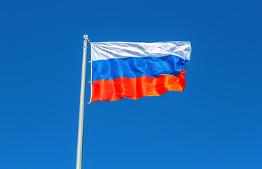Fototapeta na wymiar Flag of Russia waving in the wind against the sky